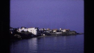1969: a view of buildings along the coast of a body of water SPAIN