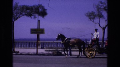1969: a horse drawn carriage stops on a street SPAIN