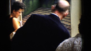 1956: women men standing looking out pointing something talking discussing CUBA