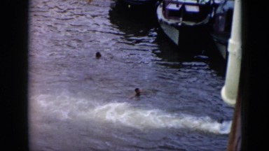 1956: a man crosses three boats CUBA