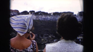 1956: two women on a river tour filming the scenery CUBA