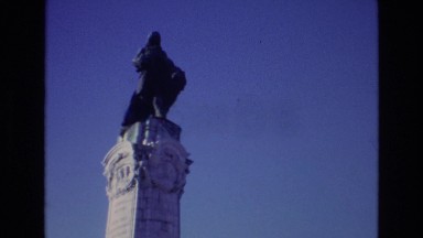 1972: Full-Size Human Statue on Top of White Pillar in Portugal