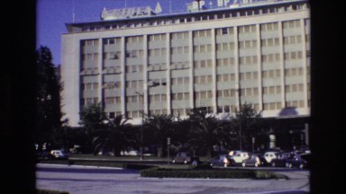 1972: two shots of a building and another with a fountain and more buildings