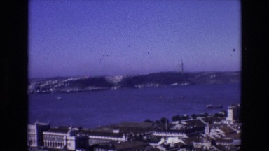 1972: Panoramic View of City and Bridge on Beautiful Day in Portugal