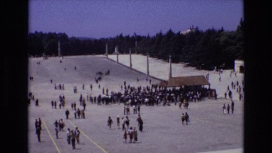 1972: large crowd walking around in an open arena. PORTUGAL
