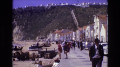 1972: townsfolk milling about beneath the mountains PORTUGAL
