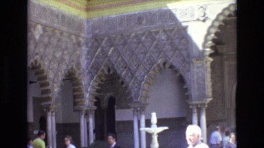 1972: A View of an Ancient Temple in India with Arched Doorways and Tourists