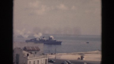 1956: a large steam ship pulling into an ocean port or harbor CUBA