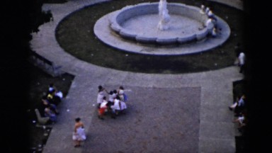1956: people milling about near a fountain, seen from above CUBA