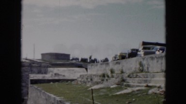 1956: different people parked at a historical landmark near the beach. CUBA