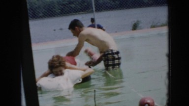 1956: the man playing with a woman in the swimming pool. CUBA