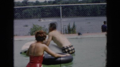 1956: a couple practicing swimming in the pool on inflated tubes CUBA