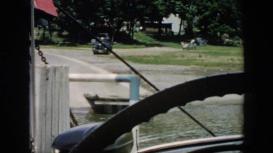 1956: cars seen from a boat steering wheel water along CUBA
