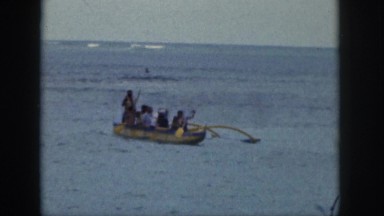 1961: outrigger canoe and catamaran frolic in waves HAWAII