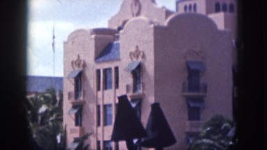 1961: an amazing apartment with many floors with some trees in the premises
