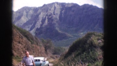1961: man walking away from his vehicle in the desert. HAWAII