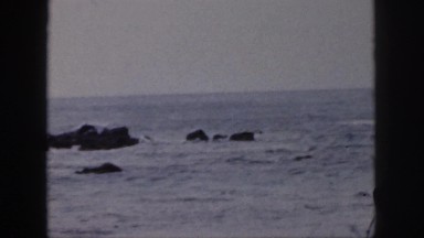 1961: people are fishing on the beach HAWAII
