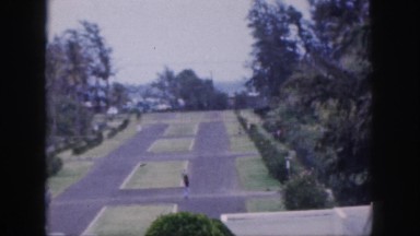 1961: plaza with plots bordered by street, plantings and building