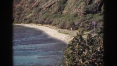 1961: small mountain overlooking wavy small beach lake HAWAII