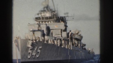 1961: large ship floating out on the ocean. HAWAII
