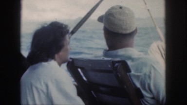 1961: man lady on a cruise by sea side on vacation enjoying the ride having fun