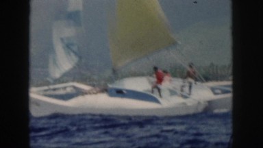 1961: people trying to keep their sailboat afloat. HAWAII