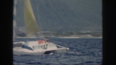 1961: enjoying the water from the view of a wind driven sailboat enjoying life