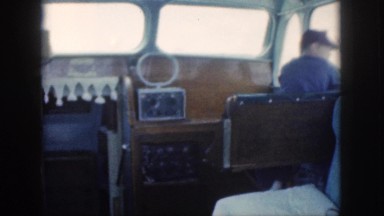 1961: two men in what appears to be the inside of a boat or yacht HAWAII