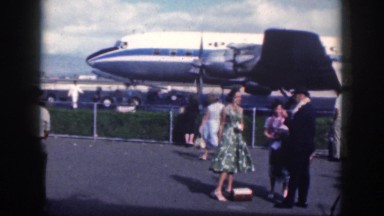 1961: a lot of people are standing in the aerodrome on a sunny day HAWAII