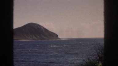 1961: a beautiful view of a mountain rising up out of the ocean HAWAII