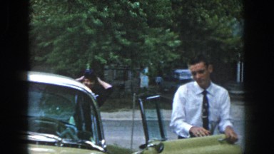 1958: Man Coming Out of Car Closing Door Talking