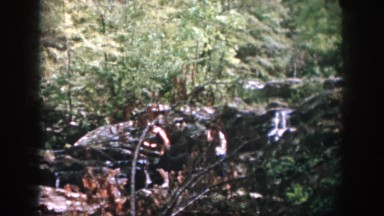 1958: Hikers Crossing a Stream in Dayton, Ohio