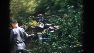 1958: a man hiking outside through wilderness with a walking stick DAYTON OHIO