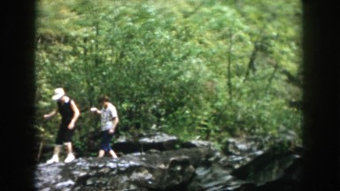 1958: three individuals hiking on rocks DAYTON OHIO