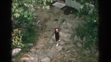 1958: a young lady walking through the stony path of the garden DAYTON OHIO