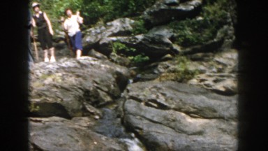 1958: people hiking on a beautiful day looking at a lovely stream. DAYTON OHIO