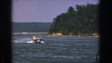 1961: a man is skating in the water pulled by a speed boat MICHIGAN