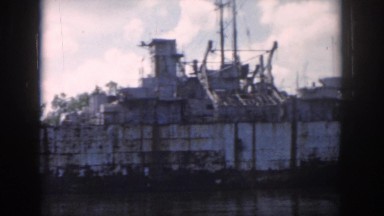 1958: floating by on the lake, viewing a massive boat. NEW ORLEANS LOUISIANA