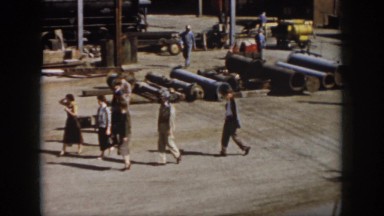 1958: pipes lying around people working walking around observing VIRGINIA