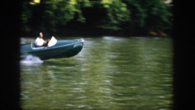 1958: man making circles in blue speedboat on lake VIRGINIA