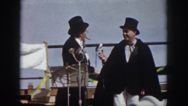 1958: two men in costumes on stage performing a musical act VIRGINIA