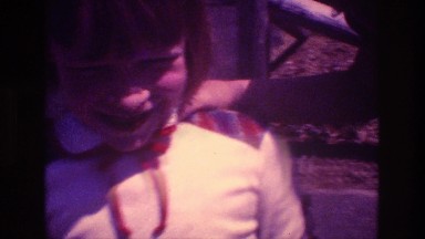 1981: a little girl with short hair and a white and plaid top SAN DIEGO