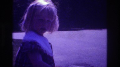 1981: A Blonde Girl Outside Talking Into a Recorder in San Diego