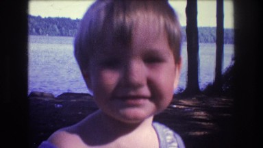 1975: a toddler sticker it's tongue out at the camera. BAXTER MAINE