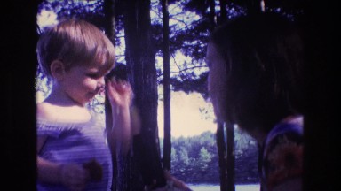 1975: woman playing with child BAXTER MAINE