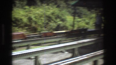 1975: miniature train tracks model constructing men BAXTER MAINE