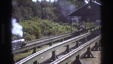 1975: people driving on a small trains towards each other. BAXTER MAINE