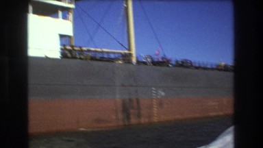 1975: huge ship parked alongside water waves BOSTON