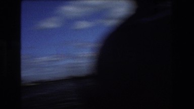 1975: a man is pissing to the water in the river who stands on the shore BOSTON