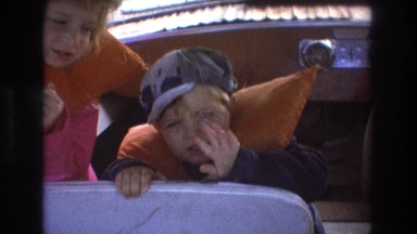 1975: two adorable blonde-haired children in life jackets on a boat BOSTON